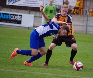 Harrogate's Dan Barrett battles with Ross Hardaker