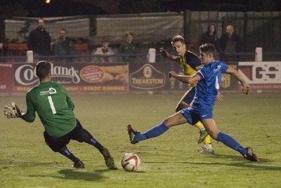 Adam Baker slides home his goal in Tadcaster's 4-1 win over Pickering. Picture: Ian Parker