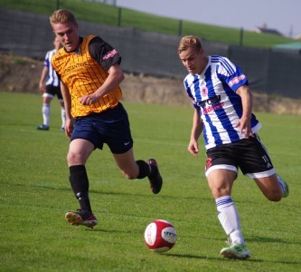 Striker Adam Priestley breaks forward for Shaw Lane