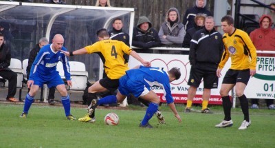 Parramore midfielder Simon Harrison is tackled