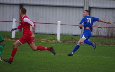 Hallam striker Jordan Cooper watches as his audacious effort heads for the goal