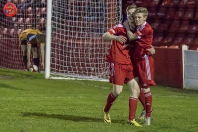 David Brown thanks Luke Mangham for his assist as Ossett Town draw level at 2-2. Picture: Mark Gledhill