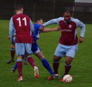 Sam Jerome defends for AFC Emley