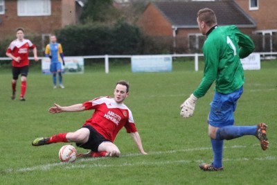 Walker wins the race with Teversal goalkeeper Dale Sheppard to put his side in front. Picture: Craig Dinsdale