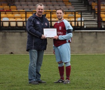 NCEL board member Karl Blackburn presents Emley captain Michael Tunnacliffe with their fair play award for December. Picture: Mark Parsons