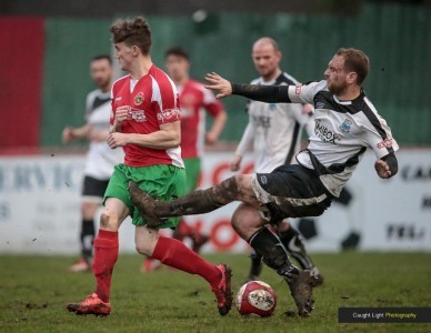 Bamber Bridge were lucky to keep ten men on the field after this tackle on Ryan Sharrocks. Picture: Caught Light Photography