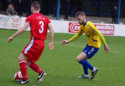 Stocksbridge midfielder Corey Gregory closes down Chasetown left-back Jonathan Haynes