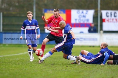 Lee Bennett's progress is halted during Shaw Lane's 2-1 win at Chasetown