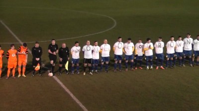 Garforth players display the shirts during the minutes' silence