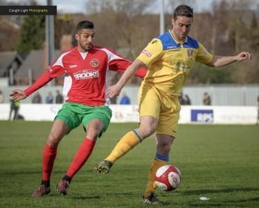 Railway striker Amar Purewal closes down returning Farsley defender James Knowles. Picture: Caught Light Photography