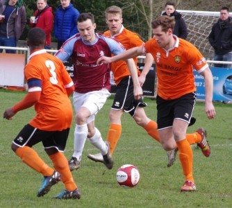 Brighouse defender James Hurtley clears his lines