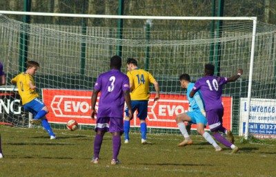 Young Keegan Parker scores his goal in Stocksbridge's 3-1 win at Daventry. Picture: Gillian Handisides