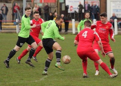 Will Ramsay and Ryan Watson prevent Ash Flynn  from causing during Selby's magnificent win over Emley. Picture: Mark Parsons