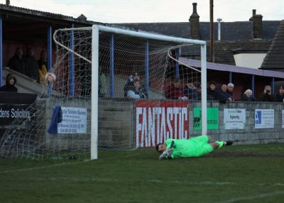 Former AFC Emley goalkeeper Joe Stead was unable to keep out Ash Flynn's penalty. Picture: Mark Parsons