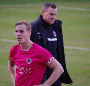 Adam Priestley looks dejected after the news of Coalville's draw