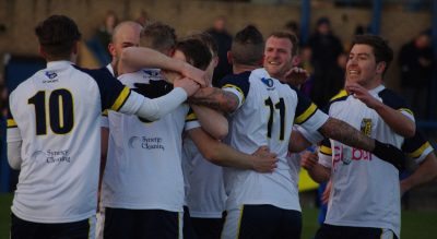 Tadcaster Albion celebrate Tom Corner's goal at Garforth