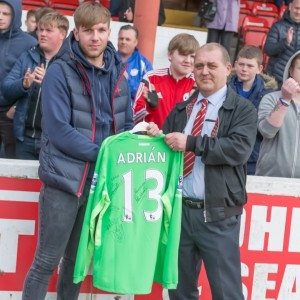 Injured goalkeeper Jack Wheat receives the signed West Ham jersey from Goole secretary Dave Oldridge 