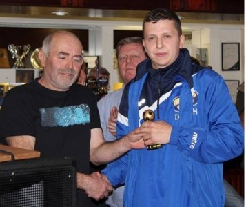 Danny Harris being presented with his Garforth Town supporters' player of the year trophy