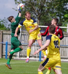 Tadcaster defender Gregg Anderson challenges for the ball