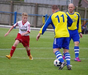 Jack Downham attempts to close down BTP midfielder Andy Selby