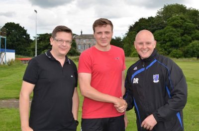 New Hall Road Rangers defender Sam Belcher (centre) with chairman Darren Sunley and manager Dave Ricardo. Picture: Lee Myers