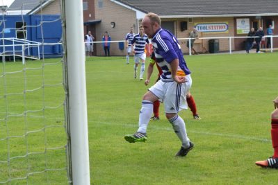 New signing Del Pollock scores his goal during Hemsworth's 5-0 win over Silsden. Picture: Pete Murden