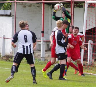 Goalkeeper Josh Archer rises to catch a cross