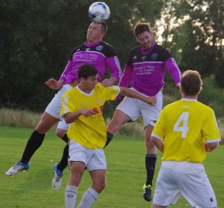 Reece Chappell and Nathan Dwyer try to win the aerial battle for Garforth Town during the 1-0 defeat at Church Fenton