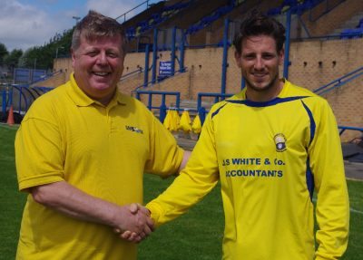 Garforth Town manager Rob Hunter welcomes Simon Poole to the J.S White Community Stadium