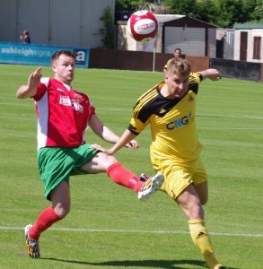 Knaresborough defender Mike Morris heads the ball away from Railway striker Steve Bromley