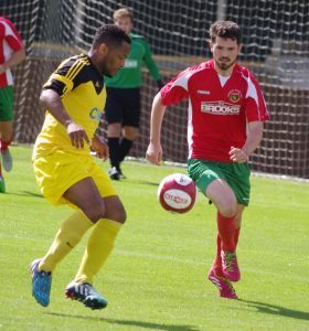 Former Leeds United winger Seb Carole looks to outsmart Harrogate defender Greg Kidd