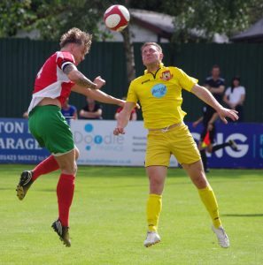 Railway defender Danny Stimpson and Knaresbrough striker Tom Woolard in an aerial battle