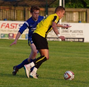 Sam Leach defending for Garforth Town