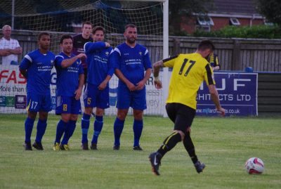 Former Leeds United midfielder Simon Walton (fourth in the wall) appeared again for Garforth Town