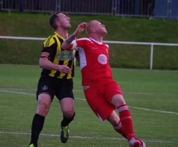 Ryan Donoghue and Handsworth striker Kieran Wells have their eyes on the ball