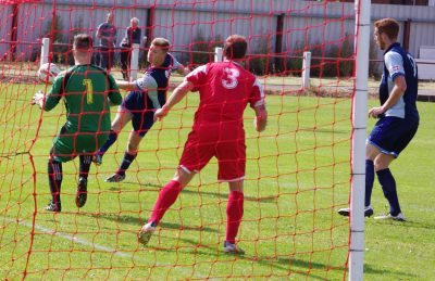 Luke Mangham hits the post with a thunderous volley