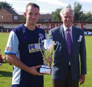 Goole AFC captain Rhys Meynell with Goole president Eric Lawton and his trophy