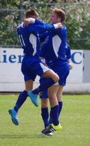 Mikey Dunn jumps into the arms of Kane Reece after scoring the opener