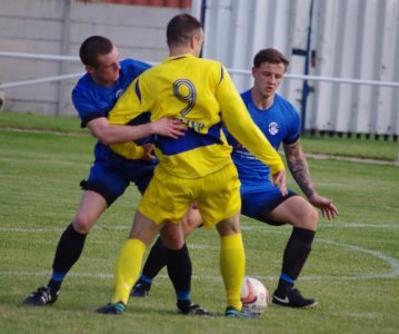 Cameron Clark and Rogan Green get tight to Lee Turner