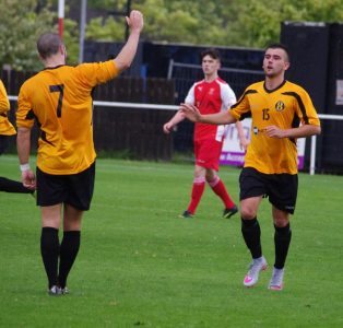 Simon Harrison (left) congratulates Connor Higginson on his goal