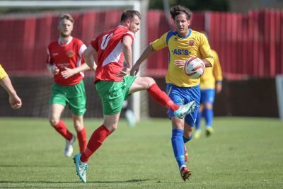 Railway goal-scorer Stephen Bromley controls the ball in front of Mansfield midfielder Danny Patterson. Picture: Caught Light Photography