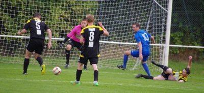 Nostell clear their lines after the ball shoots across the box