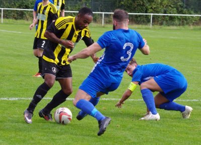 Mottley-Henry gets away from Reed, but Hallam left-back Micah Bishop comes steaming in