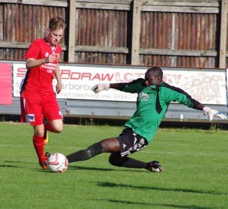 Joel Sutton goes past Bojang