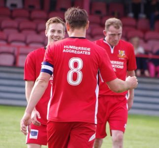 Joel Sutton goes over to Tom Fleming after the third goal is scored 