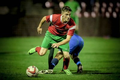 Ryan Sharrocks slips past the Worksop Town midfielder during the NCEL Premier League game. Picture: Caught Light Photography