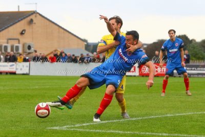 Rob Bordman holds Scarborough's Jamie Price during Shaw Lane's 2-0 win. Picture: whiterosephotos.co.uk