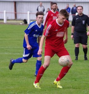 Selby midfielder Ash Hope controls the ball