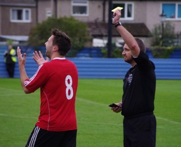 One of several unnecessary cautions by referee Neil Munday