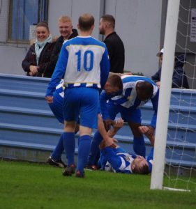 Harrop's team-mates join him to celebrate 